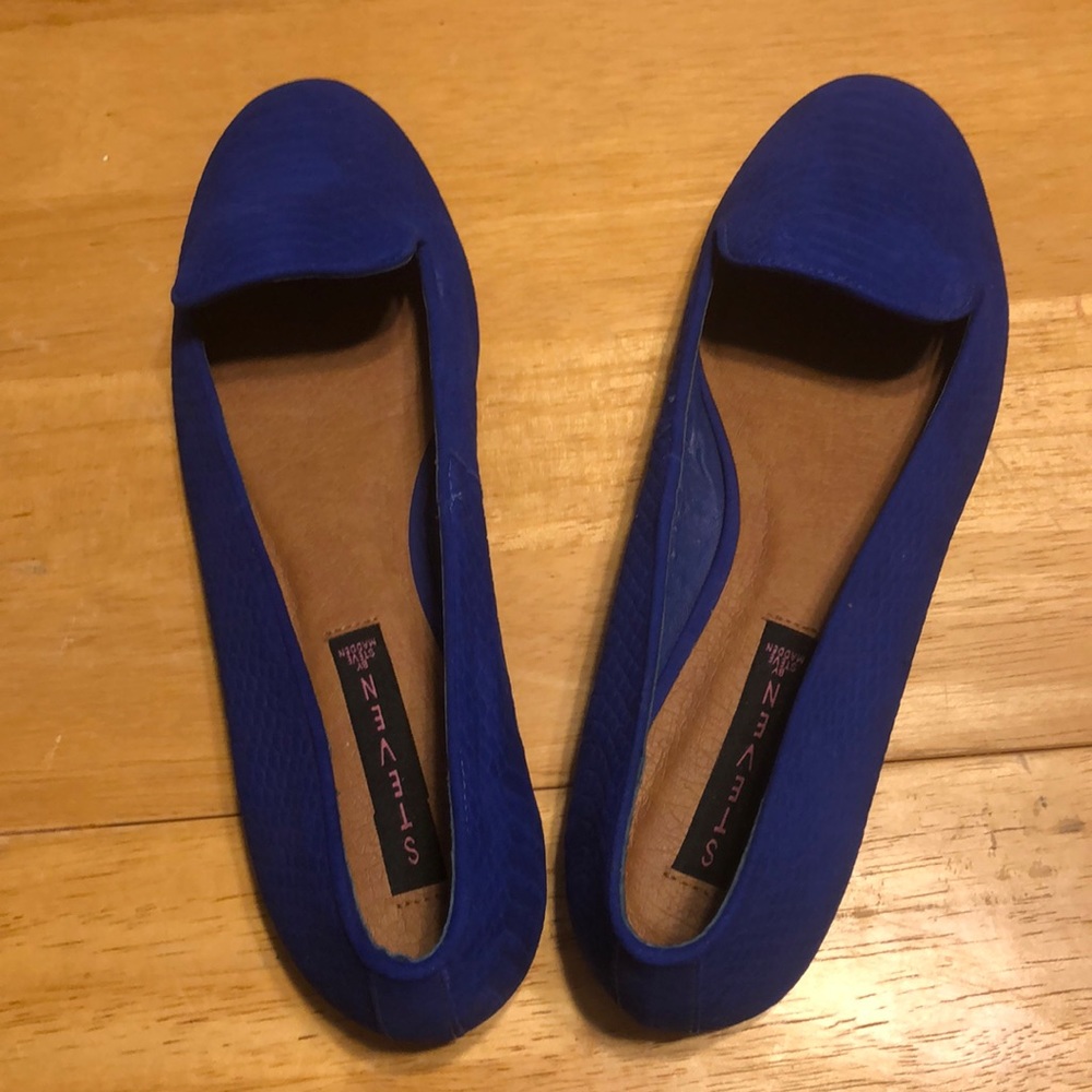 Steve Madden slip ons.